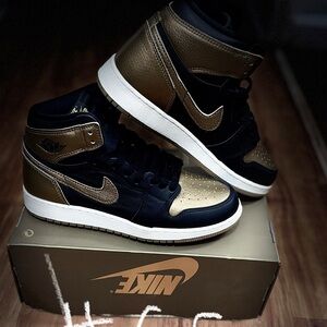 Nike Air Jordan 1 Mid in Black and Metallic Gold